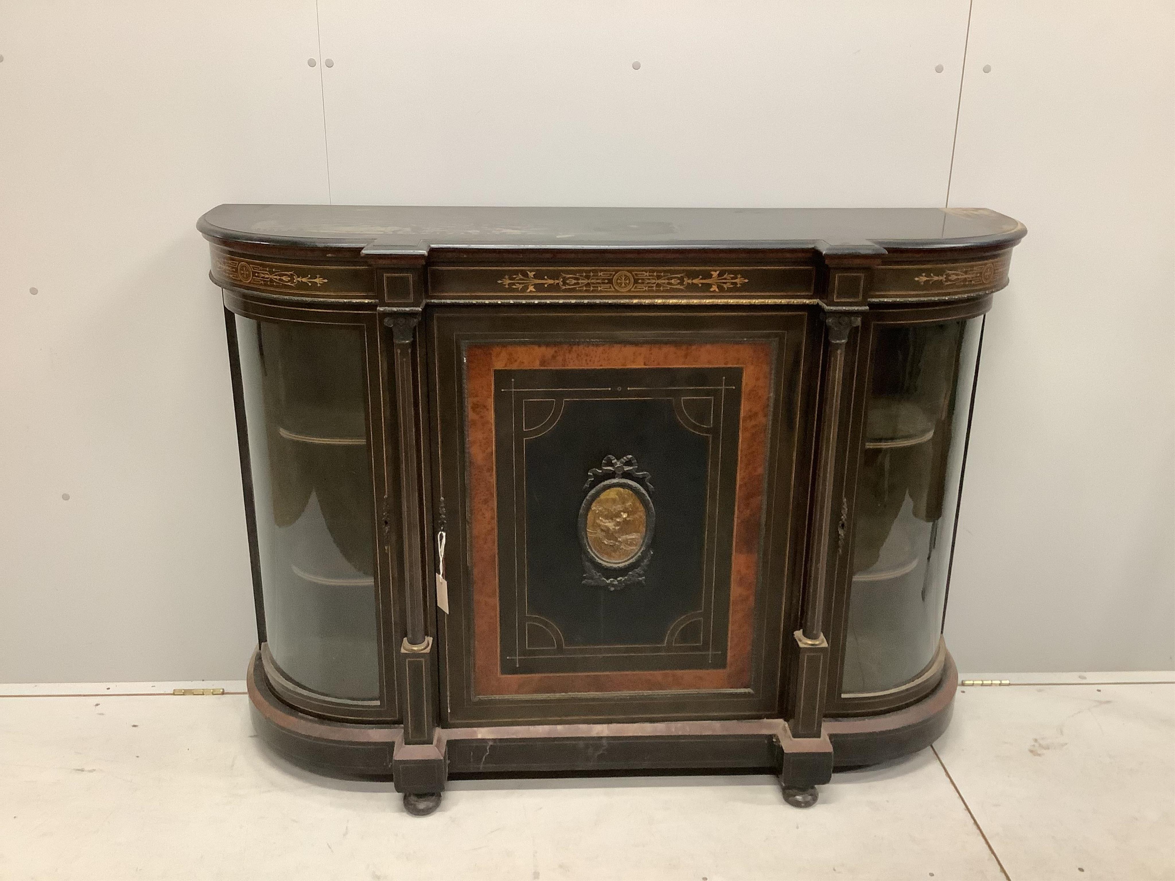 A late Victorian gilt metal mounted amboyna banded ebonised credenza, width 150cm, depth 44cm, height 106cm. Condition - poor